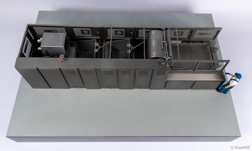 Top-down view of the cooking line model from the rear, showing tanks, basket and tote bin between guard panels